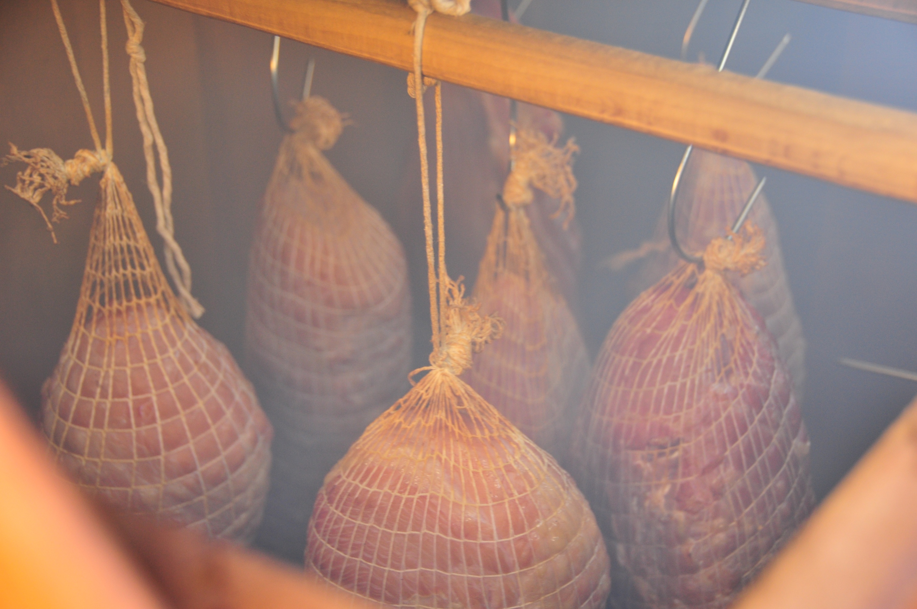 Country Hams hanging in smokehouse